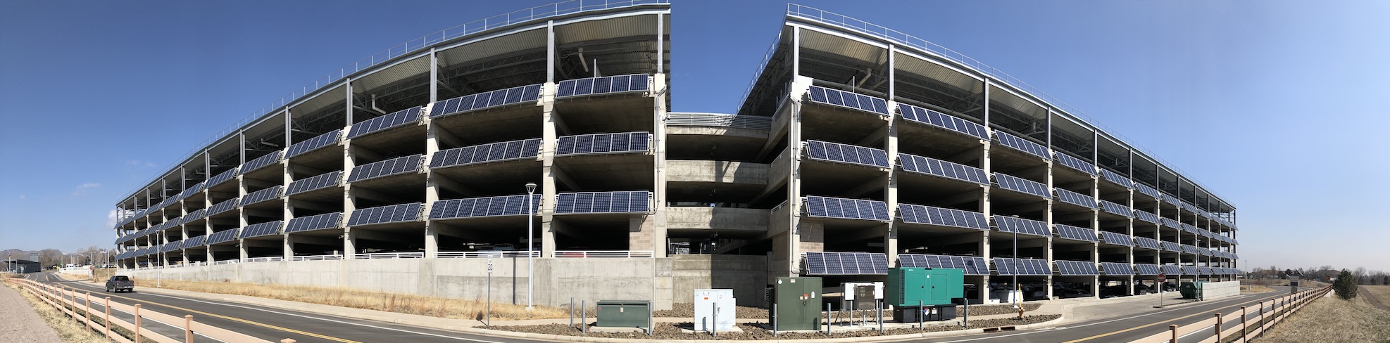 Panoramic view of the NREL garage which is covered in solar panels.